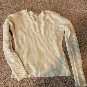 White and gold sweater